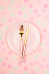 Pink plate and cutlery