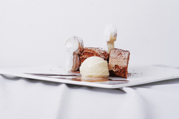 Chocolate cake with vanilla ice cream and polvoron cookie.