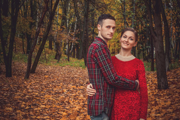 loving couple hugging in the autumn park