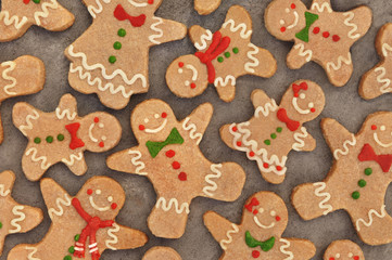 Homemade gingerbread man and girl cookies, festive Christmas and New Year sweeties background card