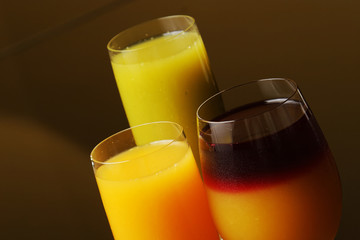Green juice, orange juice and orange juice with grenadine.