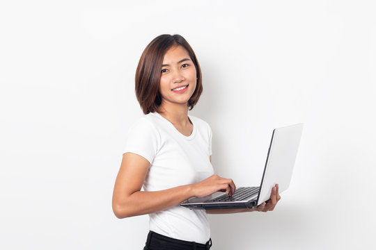 portrait asian young woman holding laptop computer on white background