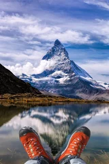 Crédence de cuisine en verre imprimé Cervin Matterhorn peak with hiking boots in Swiss Alps.