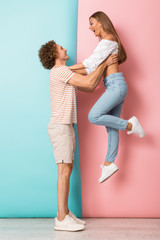 Full length of smiling young couple