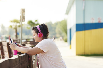 Woman choosing the best song for running