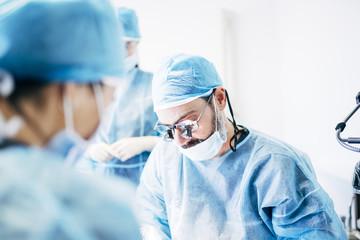 Team dental surgeons working in dental clinic.