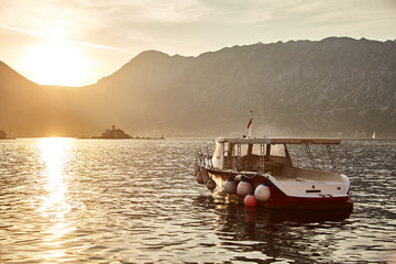 Sunset in the Bay of Kotor. A lonely yacht in the Bay of Kotor. Montenegro. 