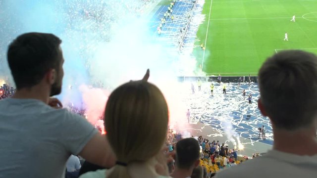 Riots in stands during football match because of unfair judgment, fans set fire