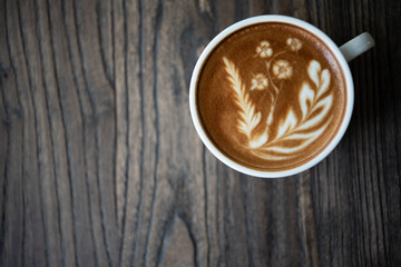 Top view latte art coffee cup.