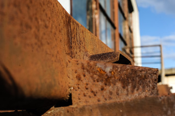 Old warehouse with rusty construction elements.