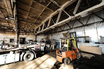 Fototapeta na wymiar Old warehouse with rusty construction elements.