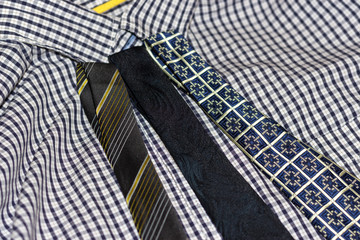 different ties lying on the shirt