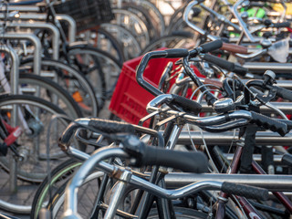 Fototapeta na wymiar Bikes parking in Amsterdam - World capital of bicycle transportation.