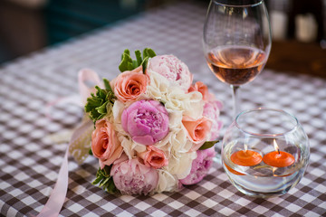 a glass of wine on a table in a cafe