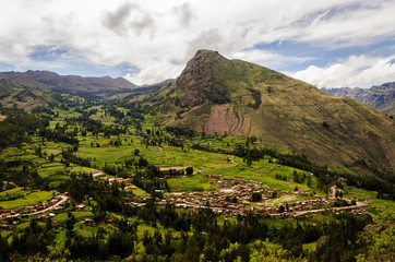 Fototapeta na wymiar Green valleys with some clouds in Valle Sagrado de los Incas, Peru