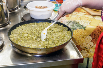 a dish is cooked in the kitchen