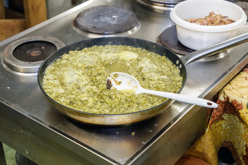 a dish is cooked in the kitchen