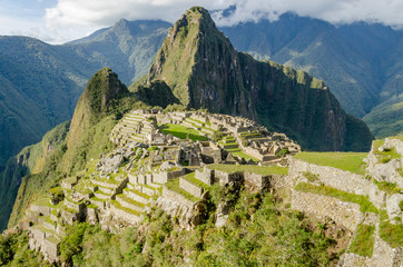 Classic photo of Machu Picchu with the face looking up and the citadel of the Incas, Peru