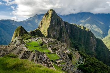 Classic photo of Machu Picchu with the face looking up and the citadel of the Incas, Peru