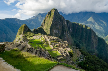 Classic photo of Machu Picchu with the face looking up and the citadel of the Incas, Peru