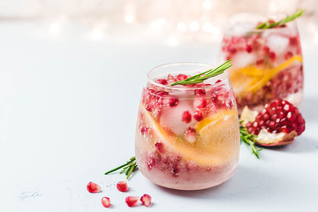 Christmas drinks, citrus, pomegranate cocktail. Selective focus, space for text.
