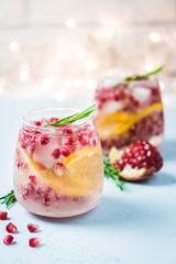 Christmas drinks, citrus, pomegranate cocktail. Selective focus, space for text.
