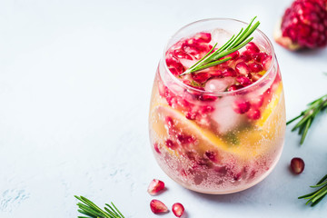 Festive drinks, citrus, pomegranate cocktail. Selective focus, space for text.