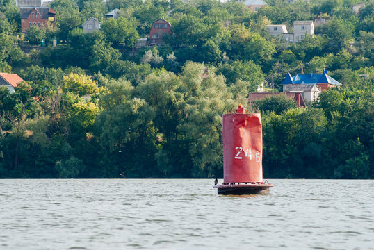old buoy on the river, red buoy,