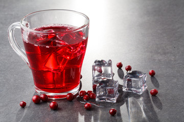Summer iced drink - cranberry tea or juice with ice