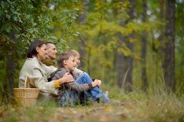 Portrait of a family of four in park