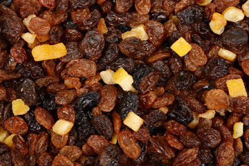 macro of raisins currants and sultanas with candied peel background