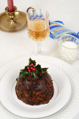 Fototapeta na wymiar traditional christmas pudding with glass of wine