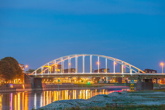 Evening view of the N344 bridge crossing the Dutch river IJssel in front of the city of Deventer
