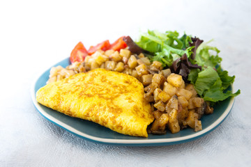French Omelette with Potatoes, Mushroom and Salad