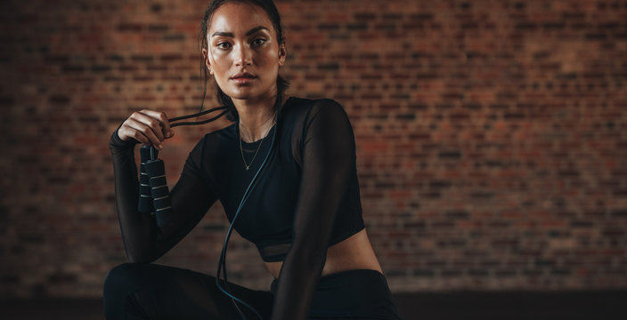 Woman Resting After Workout At Gym