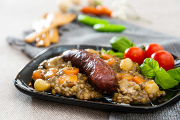 Homemade Sausage Cooked lentils with baby onions and carrots