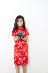 girl with holding a Eating Grape bunch