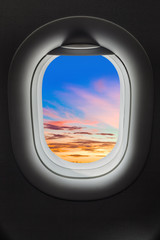 Sunset sky in airplane window