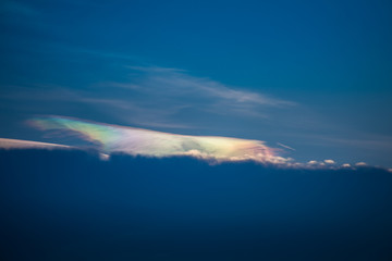 Beautiful iridescent cloud, Irisation or rainbow cloud on sky