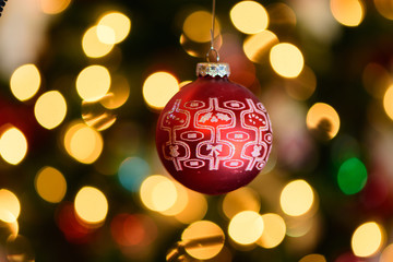 red christmas ornament on bokehed background