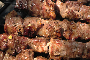 Closeup of pork skewers on the BBQ