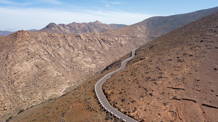 aerial view of road and volcanic mountain