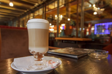 cup of cappuccino, cup of coffee on brown wooden table