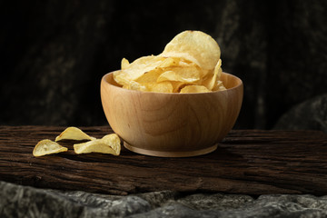 potato chip crispy in wood bowl on wood background  unhealthy cause of fat but delicious  snack