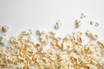 Delicious fresh popcorn on white background, top view - obrazy, fototapety, plakaty
