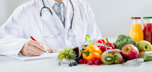 Doctor or dietitian writing a healthy food recipe