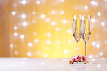 Champagne on a yellow background.