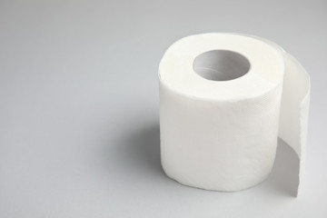 Toilet paper roll on grey background. Space for text