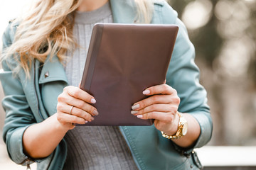 woman using tablet outdoors