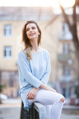 Outdoors portrait of beautiful young girl laughing